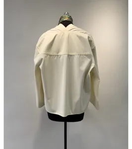 Back detail view of the minimalist cotton long sleeve shirt, featuring dropped shoulders and yoke.