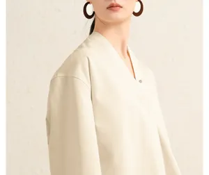 Women cotton poplin V-neck blouse sleeve detail view, minimalist casual daily apparel wear