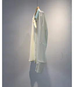 Detailed view of the elegant contrast collar long sleeve shirt, showing smooth fabric.