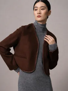 Women collarless short coat with contrast leather trim, chic commuting autumn jacket.
