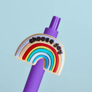 Cute rainbow silicone patch gel pen close-up detail, purple body, smooth writing stationery.