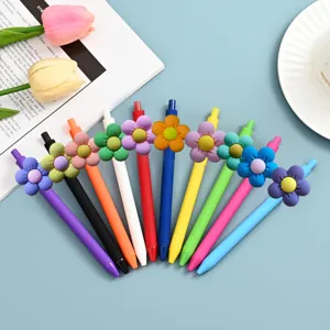 Colorful gel pens set with cute 3D flower decoration, smooth writing student stationery detail.