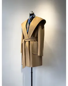 Classic camel hooded wool coat for women with waist belt and elegant draped design.