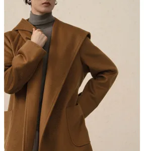 Camel hooded woolen coat detail, premium camel hair blend fabric with water ripple texture.