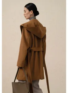 Camel hooded wool coat for women, elegant belted winter outerwear with long sleeves and hood.