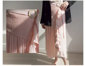 Women's pink high waist mid-length pleated skirt culottes with smocked waist and buckle.