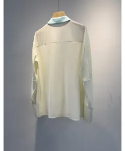 Elegant women's long sleeve blouse with contrast color lapel minimalist white shirt.