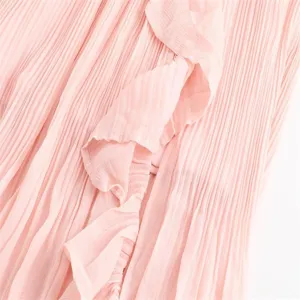 Pink pleated ruffle skirt culottes detail, elegant high waist design for women spring 2025.