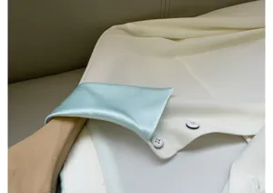 Close-up detail of a women's silk acetate color-block shirt collar, elegant and smooth.