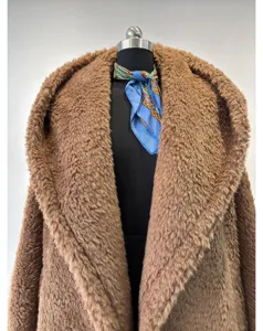 Warm oversized hooded teddy fleece woolen coat detail, featuring plush fabric and stylish design.