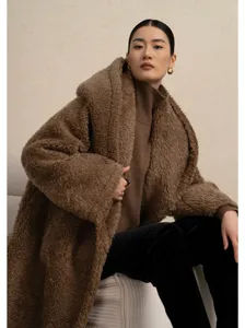 Brown wool hooded teddy coat detailed view, stylish oversized plush outerwear for women.