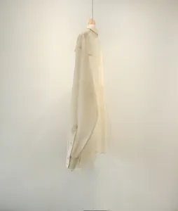 Detailed side view of a lightweight sheer acetate organza blouse, elegant loose casual shirt.