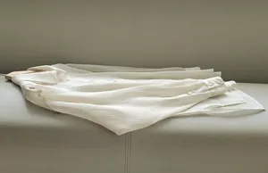 Detailed view of the sheer acetate organza shirt for women, lightweight and elegant.
