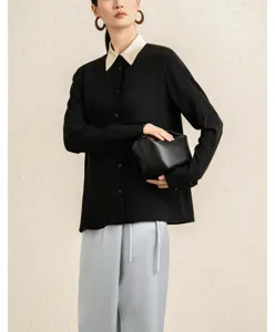 Elegant black long-sleeve shirt featuring a chic contrast collar and smooth premium fabric detail.