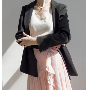Pink pleated midi skirt detail view, high-waisted chic design with elegant layers for women