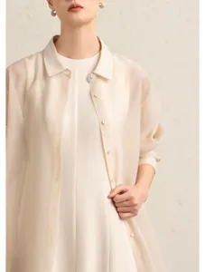Close-up detail of women's sheer acetate organza shirt cardigan, lightweight and elegant spring wear.