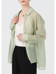 Detailed view of a sheer light green organza shirt for women, lightweight spring style.