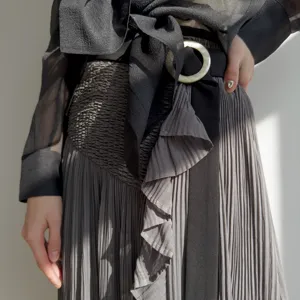 Japanese style women pleated midi skirt set featuring high waist, ruffles, and sheer blouse.