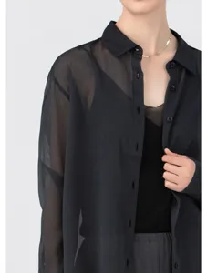 Close-up detail of sheer black organza long sleeve button-down shirt for women spring.