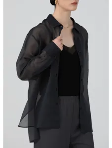 Sheer black organza shirt detail, lightweight translucent button-up long sleeve top view.