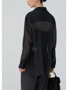 Detail view of the elegant sheer black organza long sleeve shirt, showcasing lightweight texture.