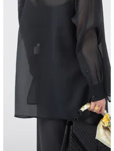 Sheer black organza long sleeve shirt blouse, lightweight breathable summer fashion detail.