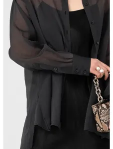 Close-up detail of sheer black long sleeve chiffon blouse, lightweight elegant texture.
