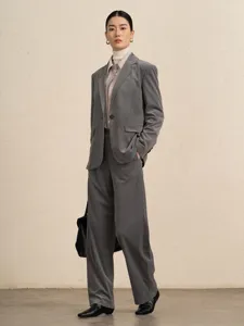 Stylish women grey corduroy suit set featuring tailored blazer and wide-leg pants for autumn.