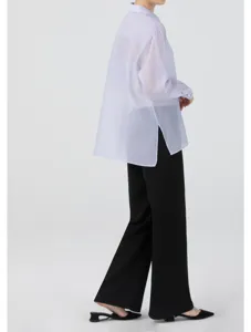 Detail view of a sheer light purple organza long sleeve blouse, elegant translucent style.