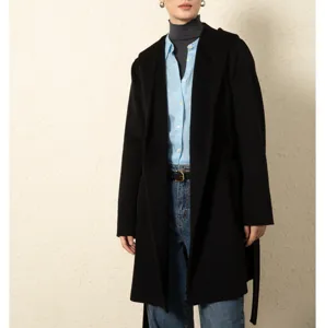 Detailed view of the women's elegant black hooded wool coat, featuring classic wrap styling.