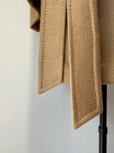 Classic camel wool wrap coat for women with stylish stitching details and warm fabric.