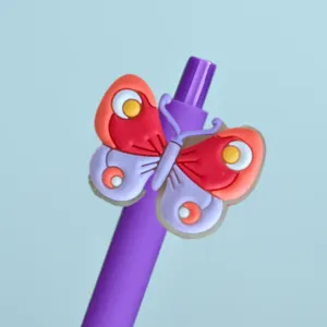 Close-up detail of a cute purple neutral pen featuring a colorful 3D silicone butterfly charm.