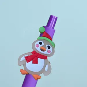 Cute penguin gel pen detail shot, featuring a colorful silicone topper on purple body.