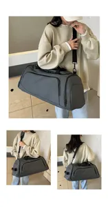 Large capacity gym duffel bag in dark gray, versatile travel sports bag with shoulder strap.