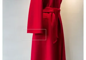 Detail shot of red cashmere double-faced wool bathrobe coat cuff and pocket design.