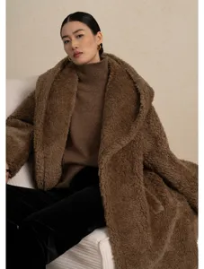 Detail shot of the cozy brown teddy coat featuring soft fleece texture and elegant lapel design.