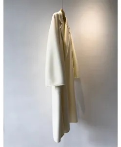 Elegant long cashmere-blend wrap coat for women, premium winter outerwear in classic off-white.