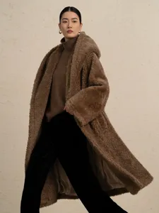 Long brown teddy bear coat for women, hooded loose wool blend winter outerwear, warm stylish apparel.