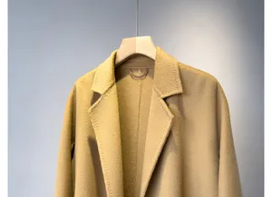 Detailed view of the luxury cashmere wool blend bathrobe coat, elegant lapel and fine texture.