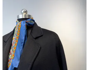 Elegant cashmere blend double-faced long wool coat for women featuring a stylish blue silk scarf.