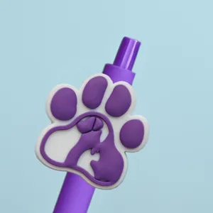 Detailed close-up of cute purple gel pen with 3D cartoon paw print topper for office stationery.