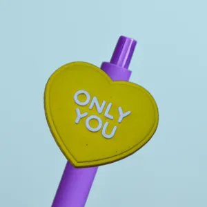 Cute heart-shaped gel pen with purple barrel and love quote, perfect for student daily writing.