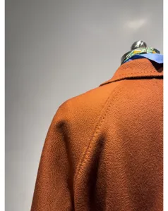 Cashmere wool bathrobe coat detail, showing shoulder seam, premium texture and luxury drape.
