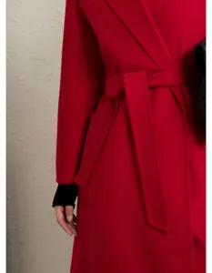 Red cashmere blend wrap coat detail, elegant long winter outerwear belt view style.