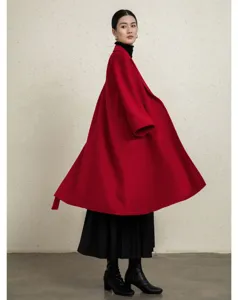 Detail view of women red cashmere wool blend long coat winter elegant oversized outerwear.