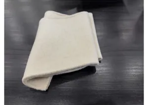 Échantillon de tissu en laine cachemire blanc cassé doux et texture hivernale de qualité