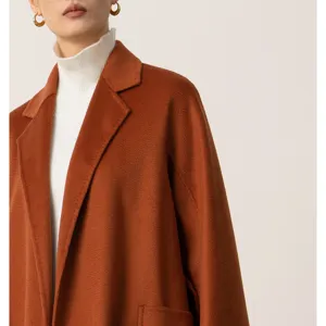 Detail view of women's long cashmere blend robe coat in camel, elegant winter outerwear.