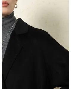 Black double-faced lapel long wool coat for women, elegant autumn winter outerwear style.