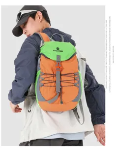 Detailed view of lightweight hiking backpack in orange and green worn by model during outdoor use.
