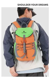 Detail view of lightweight hiking backpack with adjustable buckles and elastic cords for outdoor sports.